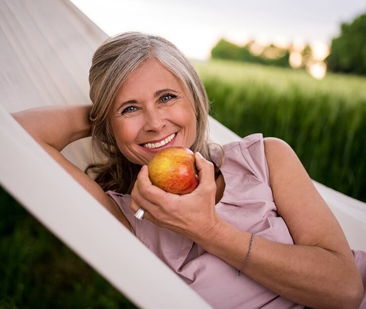 woman holding an apple